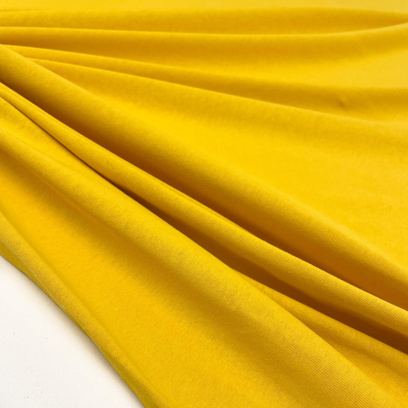 Yellow Jersey Cotton fabric made in Italy, available now on en.tessuti.fr