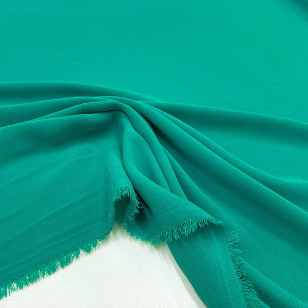 Fabric Crepe of Turquoise Polyester, to be found on en.tessuti.fr
