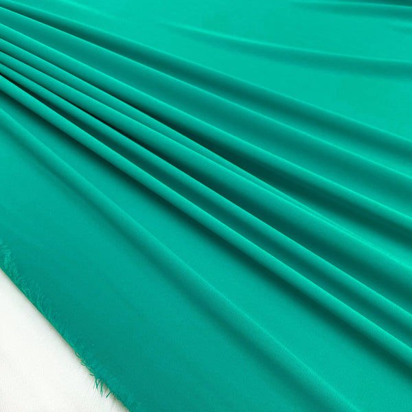 Fabric Crepe of Polyester Turquoise Made in Italy, to find now on en.tessuti.fr