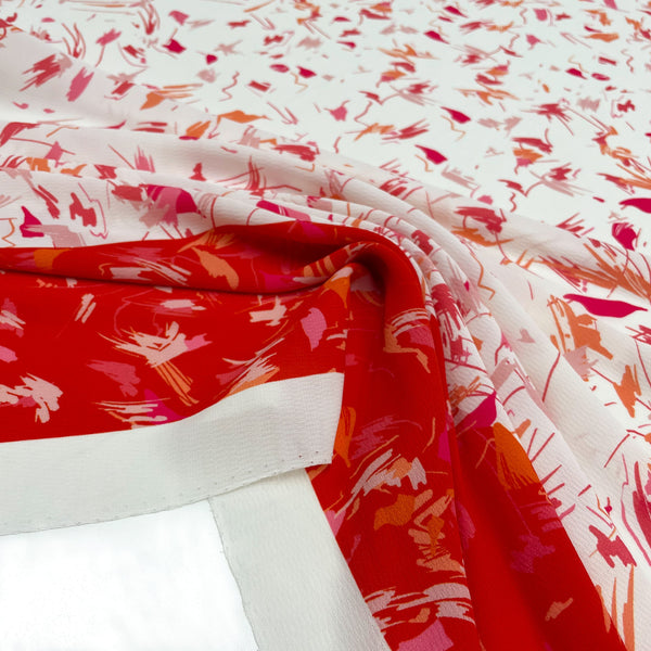Fabric Crepe Scarabocchio red print Made in Italy, to discover on en.tessuti.fr