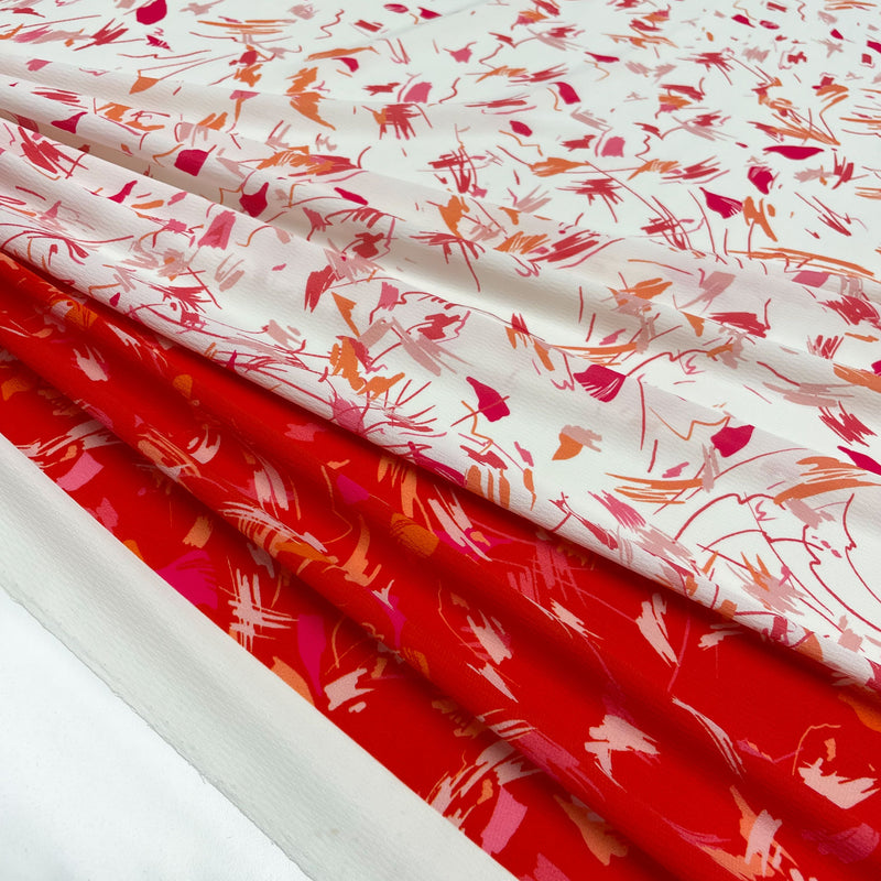 Fabric Crepe Scarabocchio red print Made in Italy, to discover now on en.tessuti.fr
