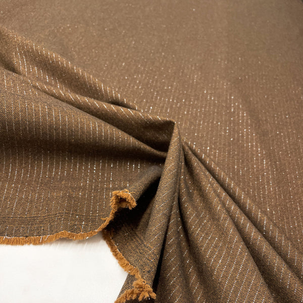 Brown Polyester and Viscose fabric, to be found on en.tessuti.fr